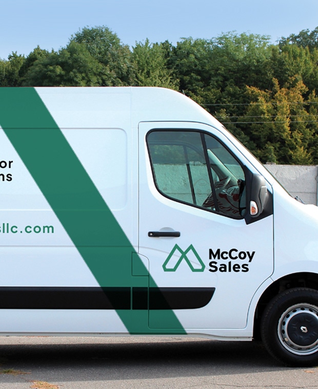 Work van with McCoy Sales logo on door panel